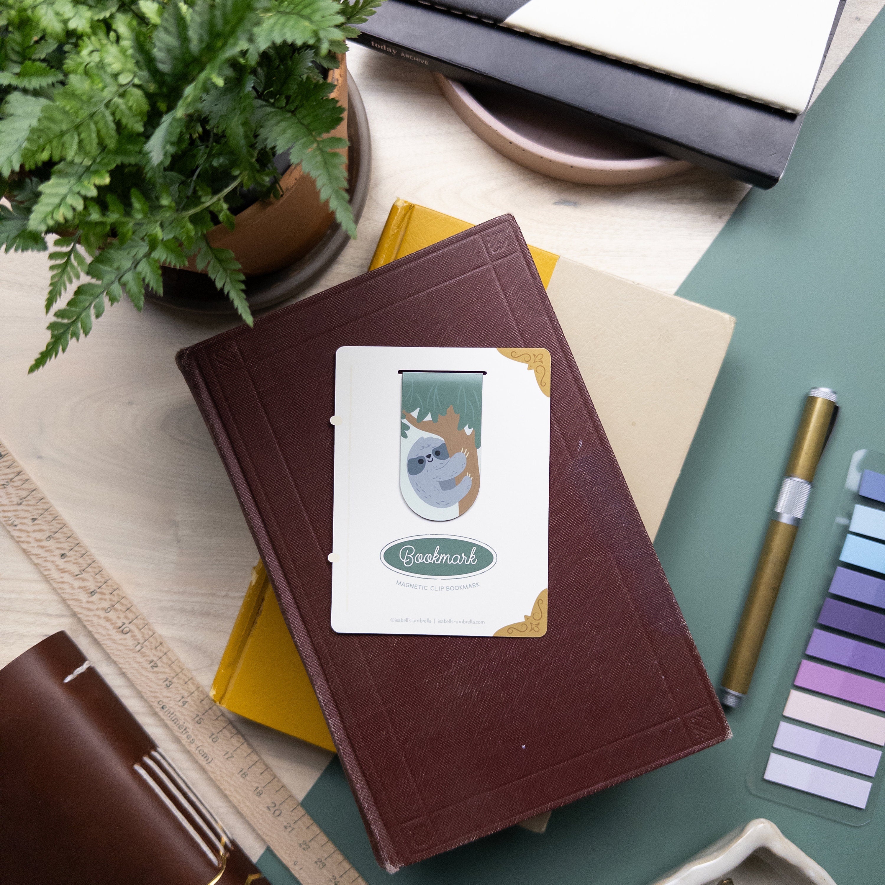 Cute illustrated sloth magnetic bookmark clip, laminated for durability, perfect for journals, planners, and readers.