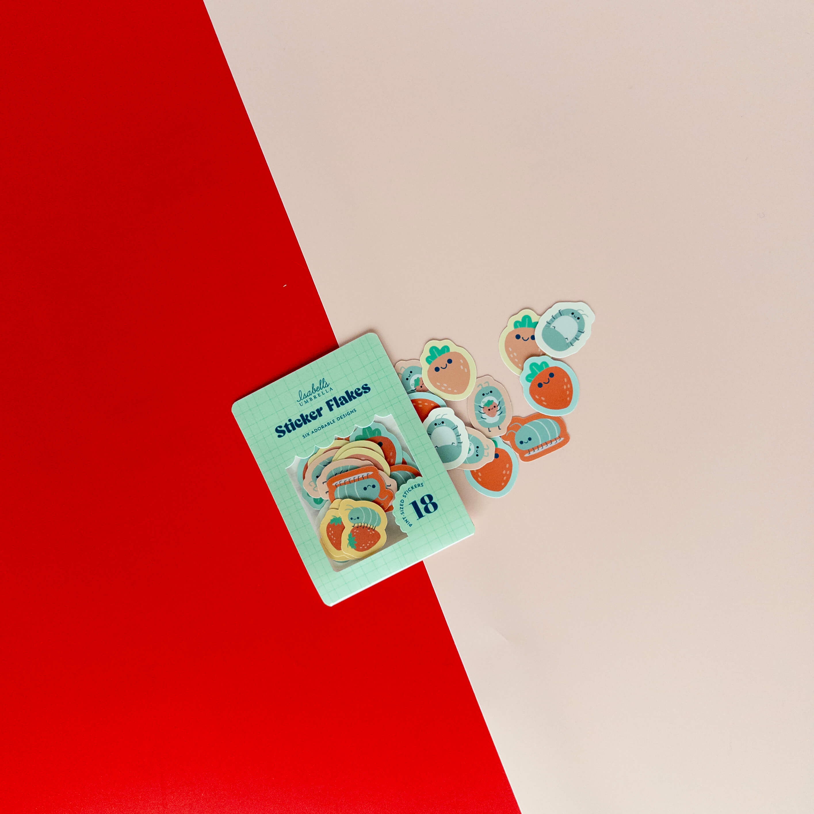 Cute roly poly sticker flakes scattered around their packaging on a red and cream background.
