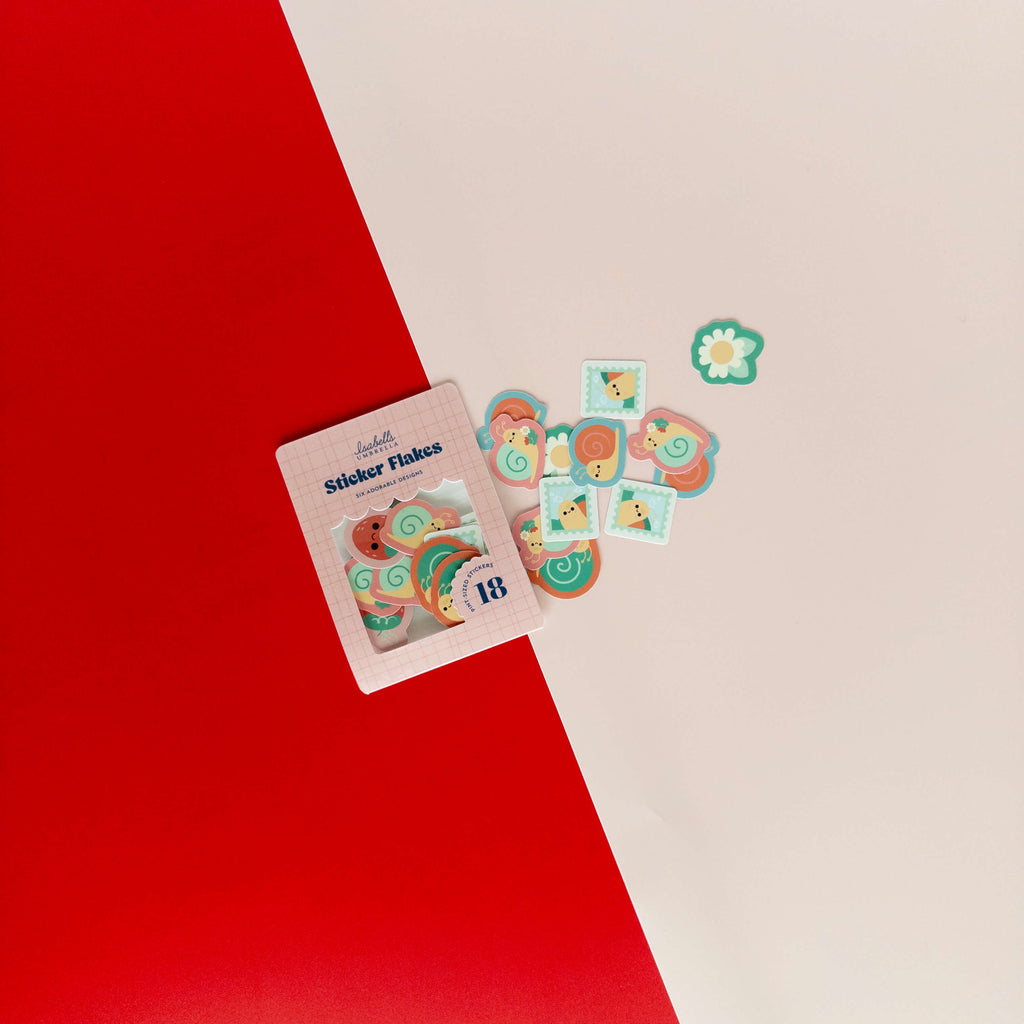 Cute snail sticker flakes scattered around their packaging on a red and cream background.