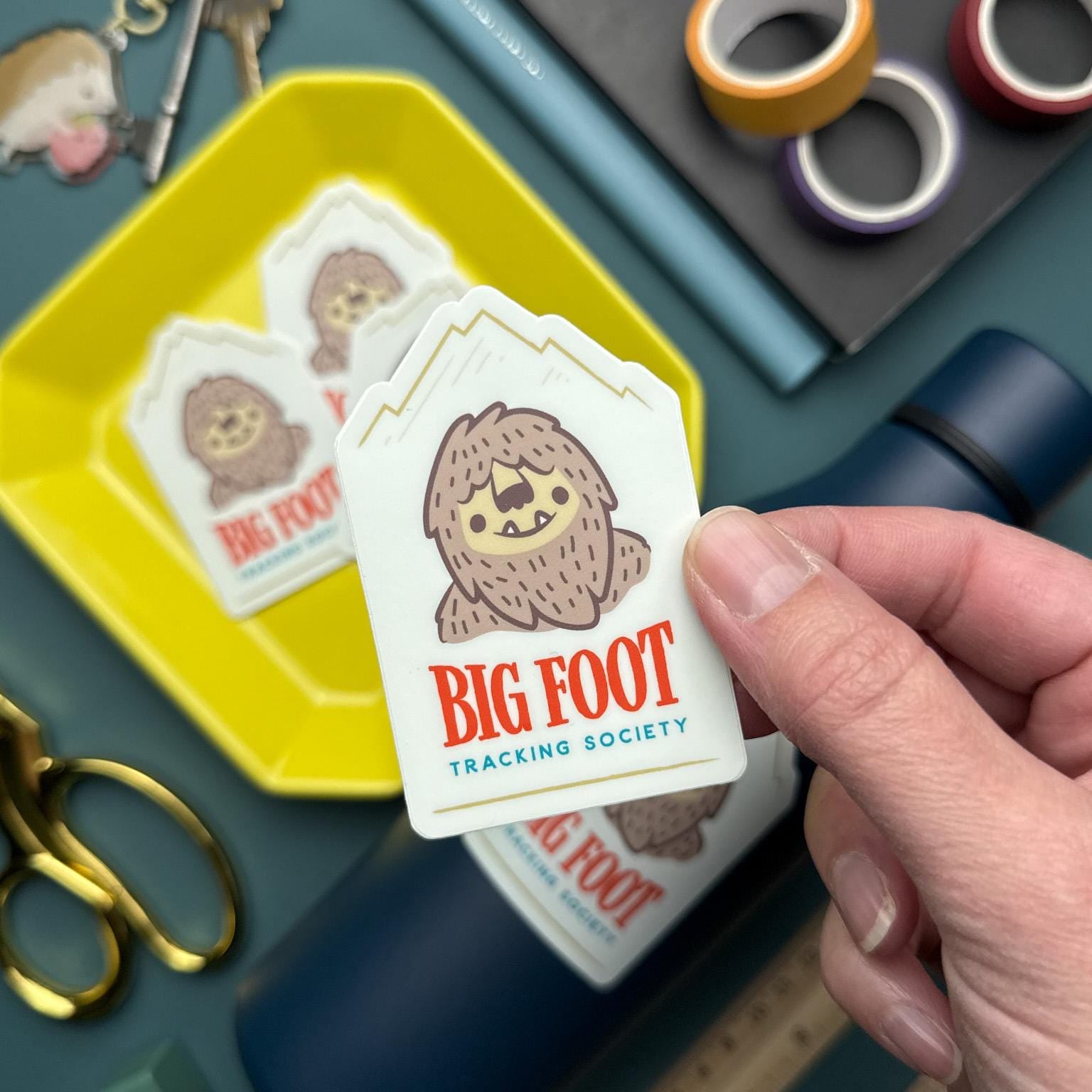 Big Foot Tracking Society vinyl sticker featuring a cute Sasquatch design, waterproof and durable decal for water bottles, laptops, and outdoor gear.