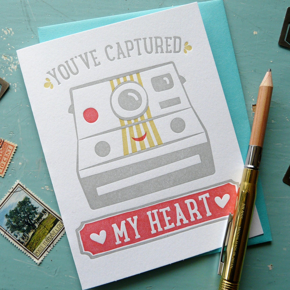 An illustrated letterpress card with “You’ve Captured My Heart” camera design, cute hand-printed love and friendship notecard with envelope.