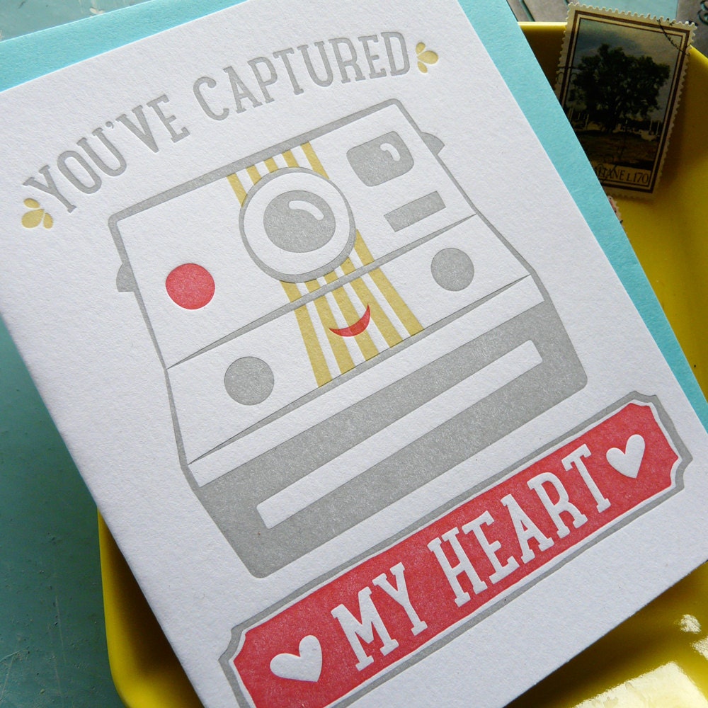 Detail of an illustrated letterpress card with “You’ve Captured My Heart” camera design, cute hand-printed love and friendship notecard with envelope