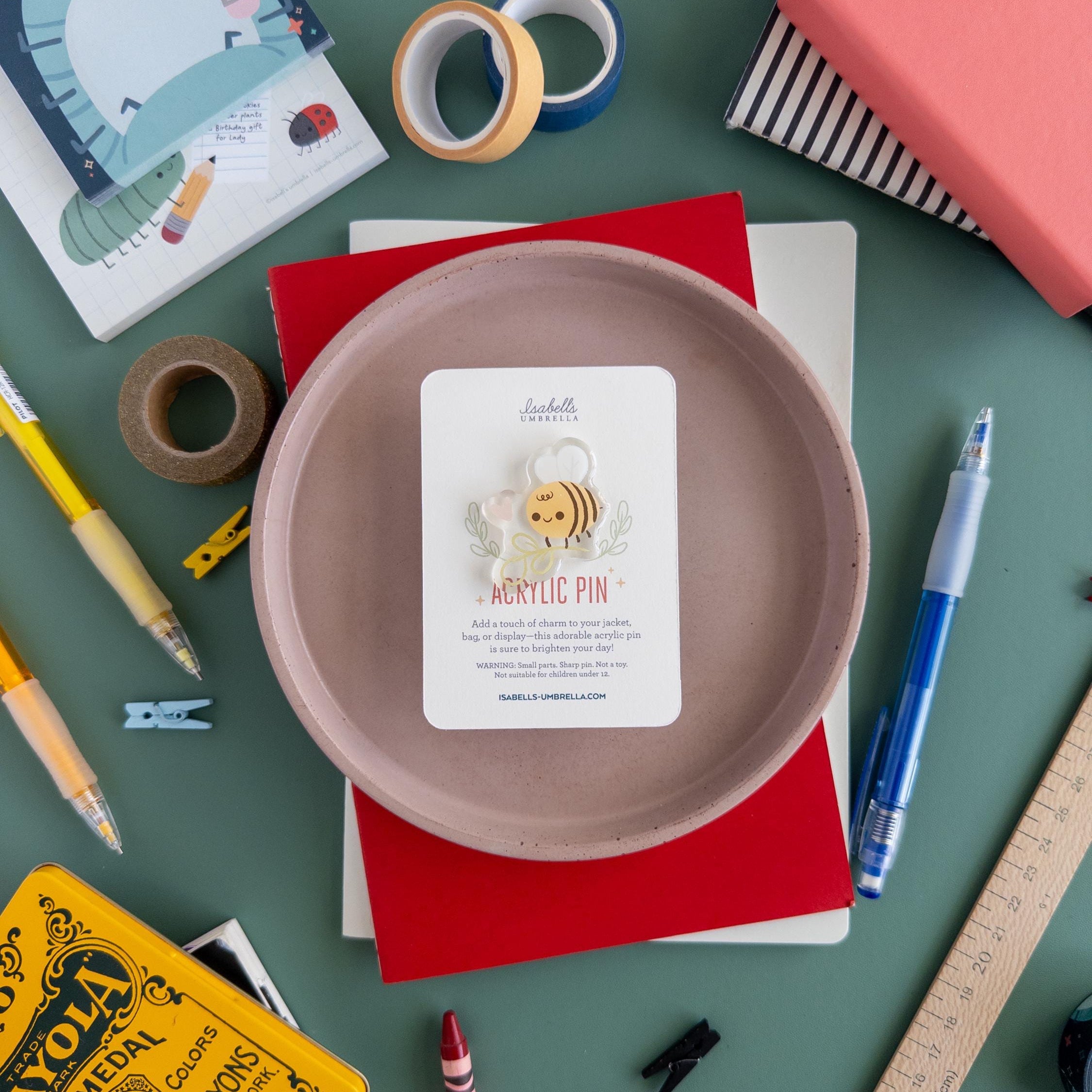 Cute bee with flower acrylic pin featuring glossy epoxy finish, kawaii cottagecore brooch perfect for jackets, totes, and gifts for bee lovers.