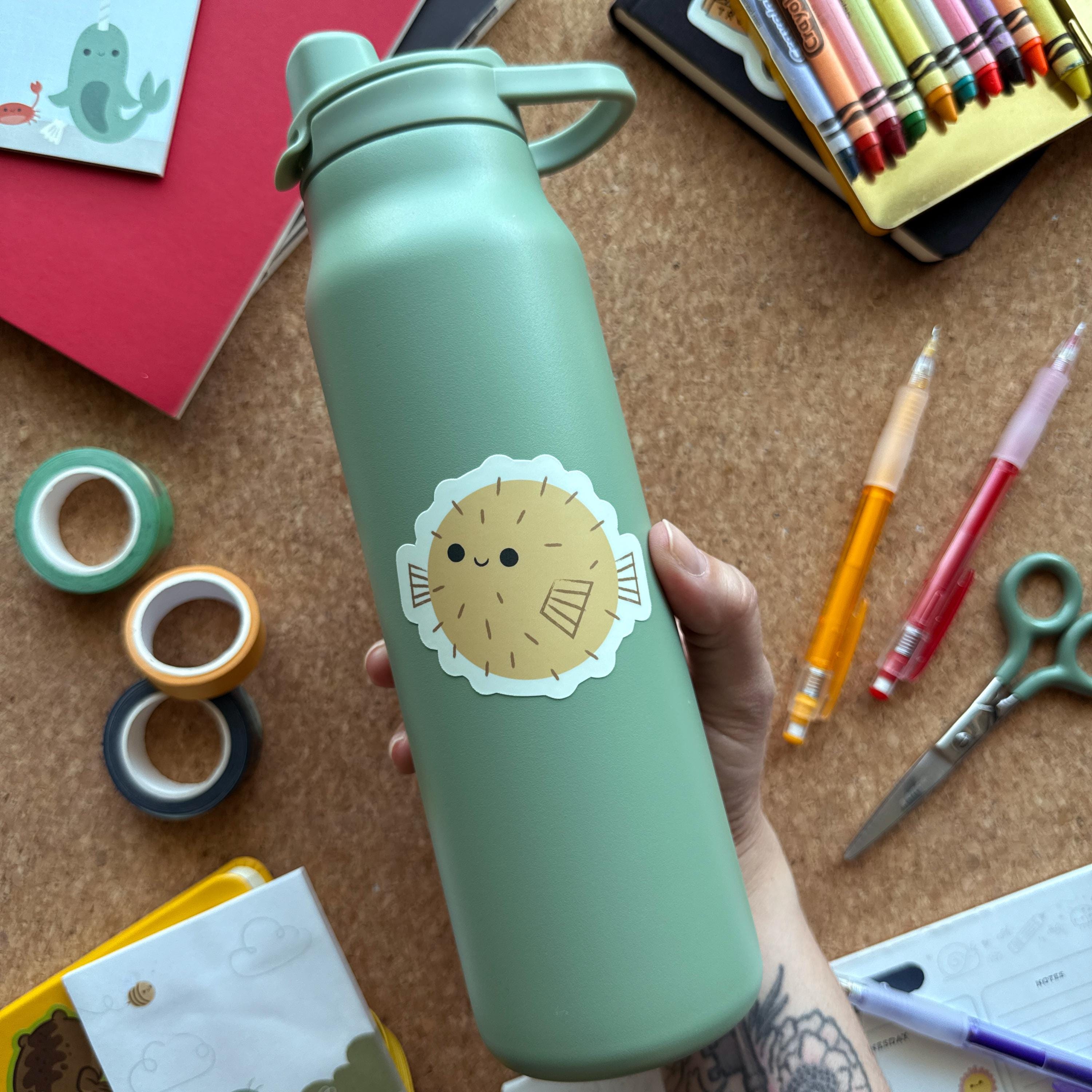 Cute puffer fish vinyl sticker featuring a round spiky fish design, waterproof matte decal for laptops, water bottles, and ocean lovers.