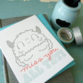 Cute illustrated letterpress card featuring a friendly yeti with “Miss You All” message, handmade stationery with coordinating envelope.