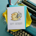 Illustrated letterpress birthday card featuring a cute monster eating cake with a coordinating envelope, hand-printed vintage design.