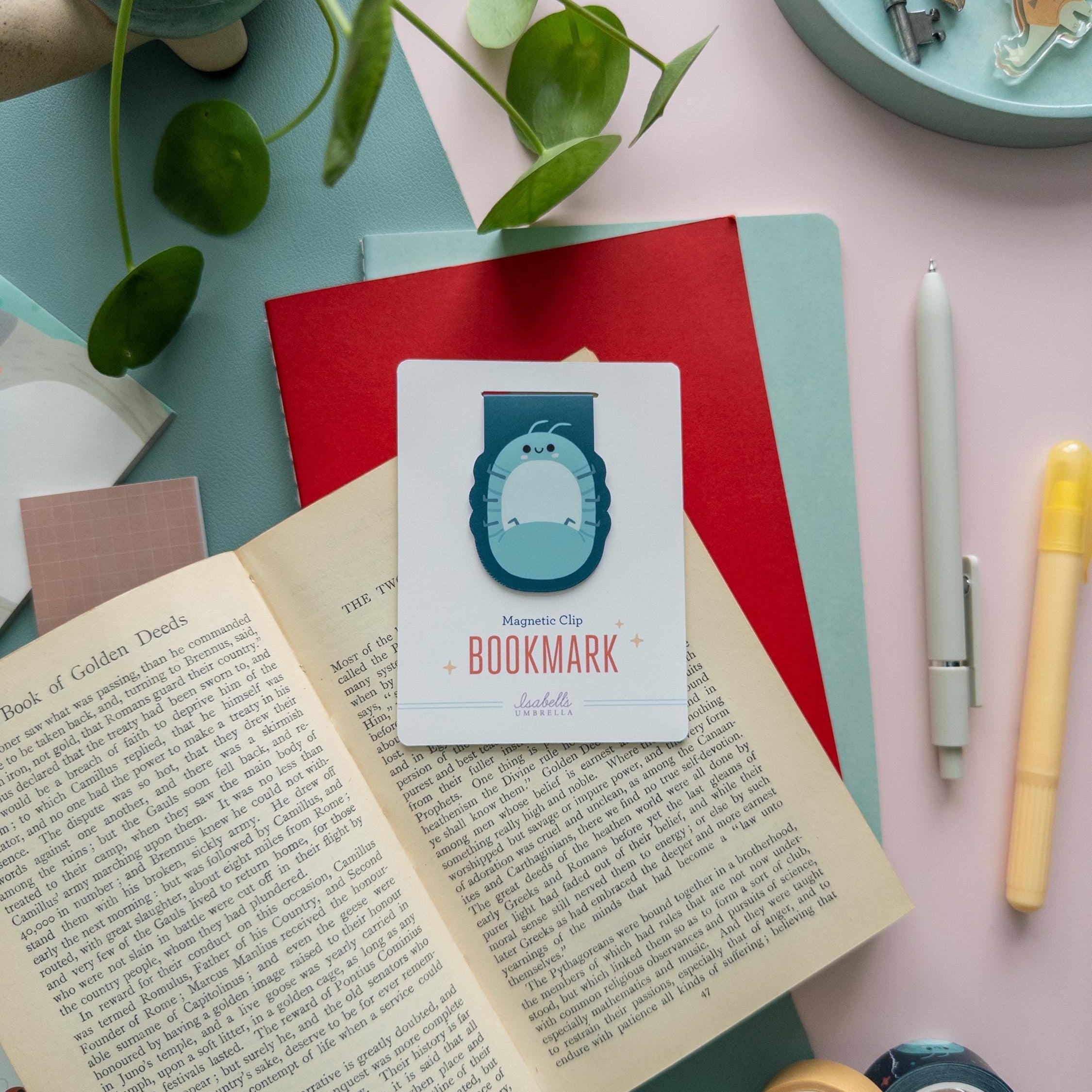 Roly Poly bug magnetic bookmark displayed on branded backer card, matte finish, perfect cute stationery gift for readers.