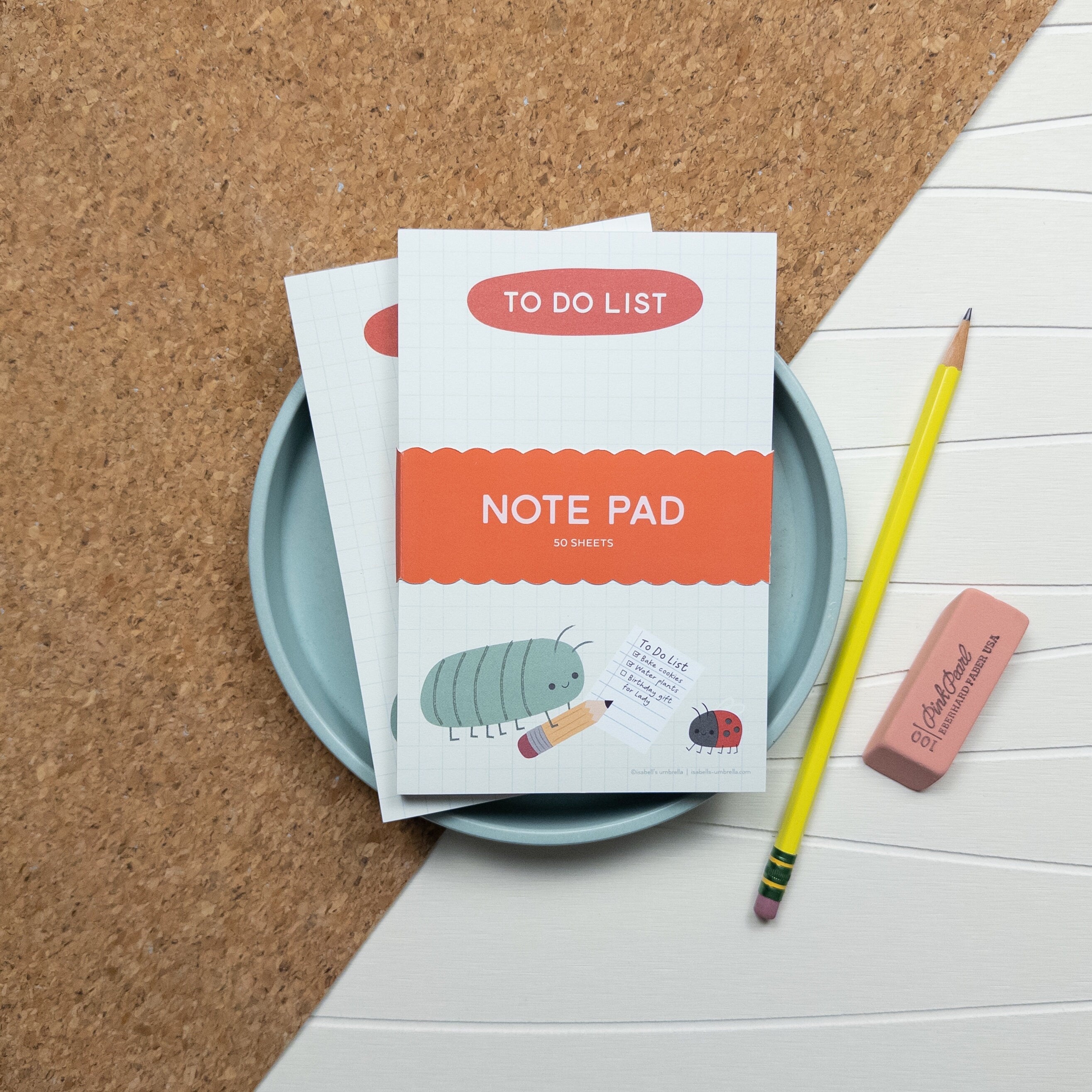 To-do list notepad with a cute illustrated roly-poly with a pencil writing a to-do list with is friend ladybug.