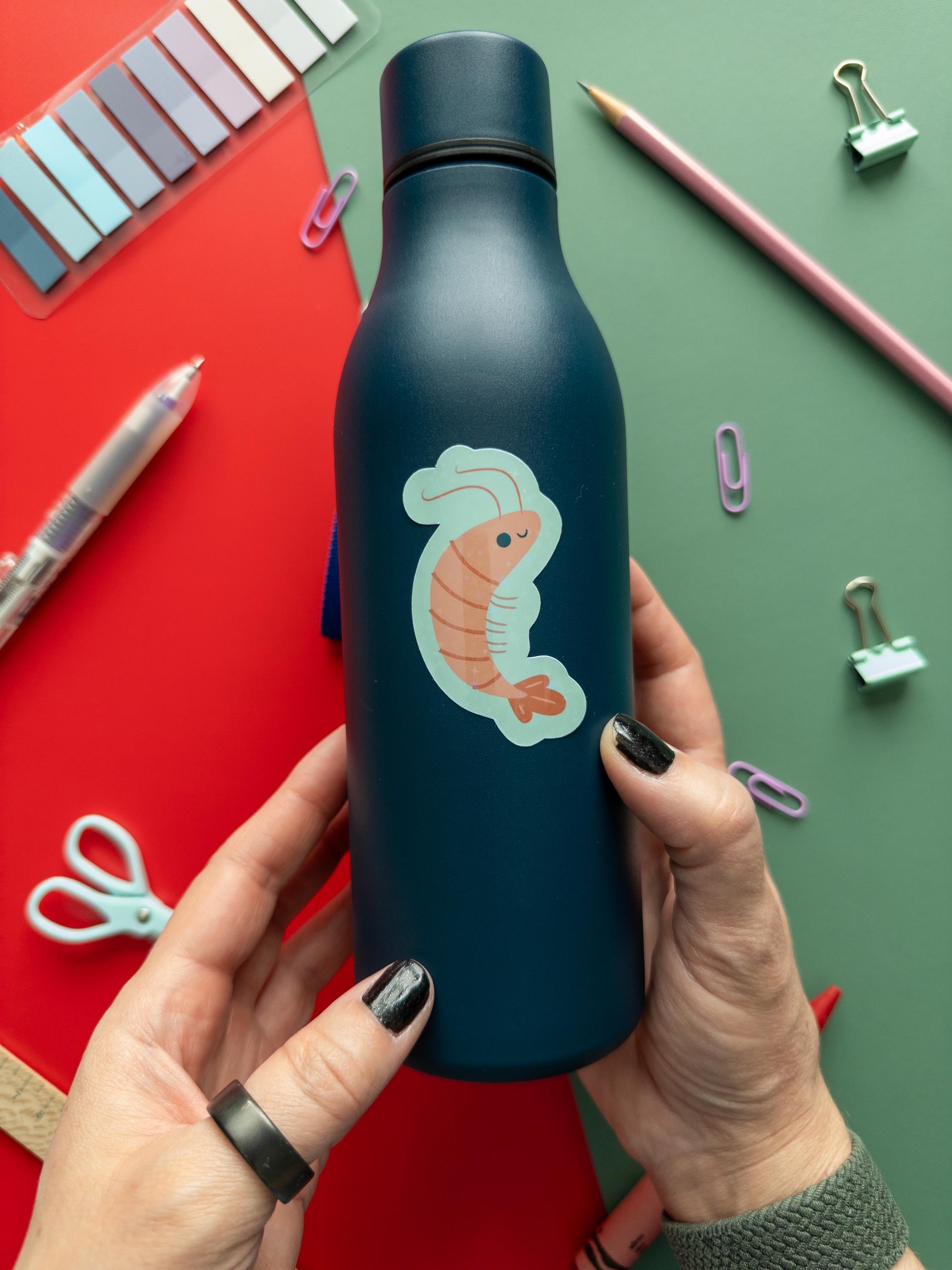 Cute glitter shrimp vinyl sticker with sparkly finish, waterproof and durable sea creature decal for laptops, water bottles, and journals.