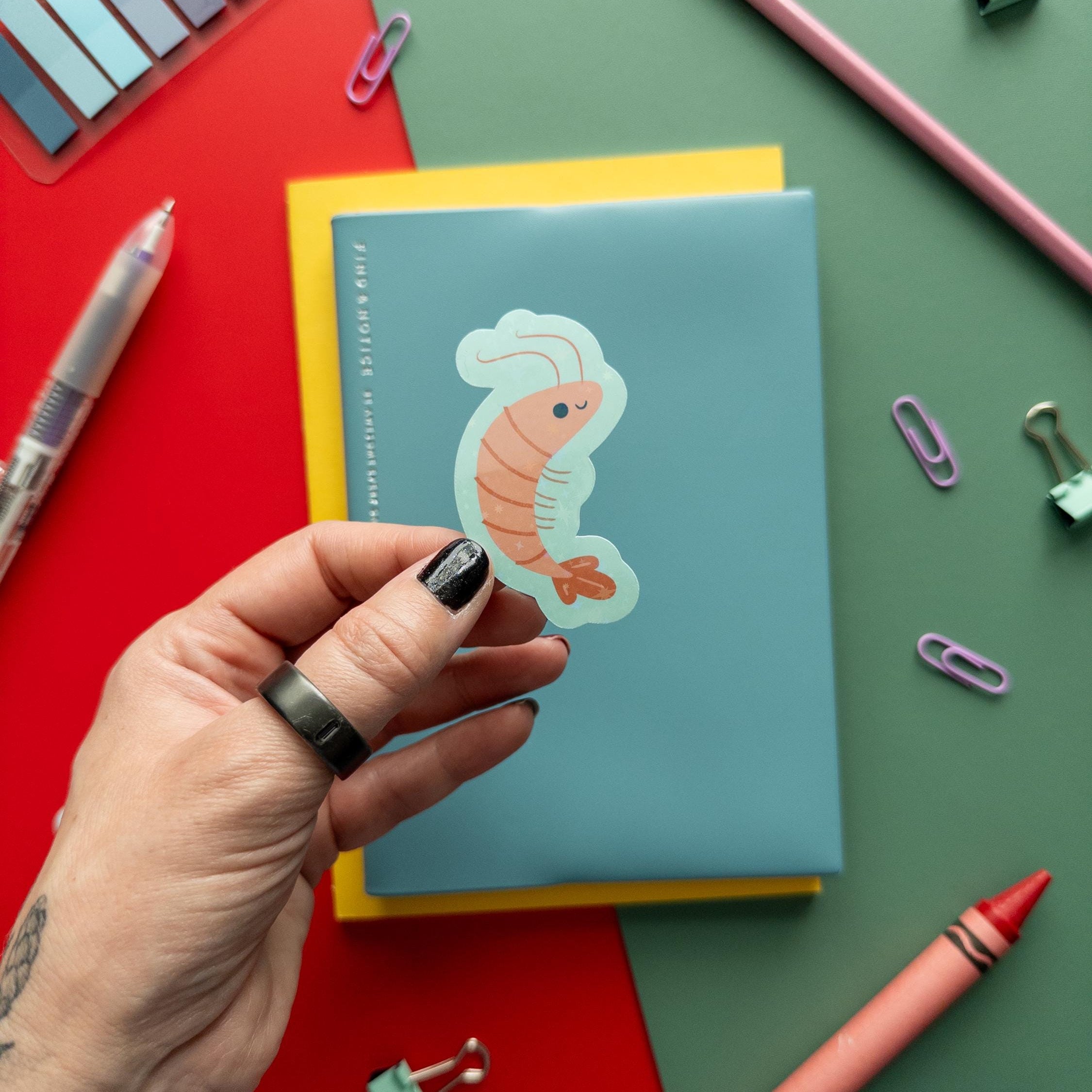 Cute glitter shrimp vinyl sticker with sparkly finish, waterproof and durable sea creature decal for laptops, water bottles, and journals.