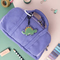 Cute Stegosaurus acrylic keychain with glossy epoxy finish, kawaii dinosaur charm for bags, backpacks, and keys.