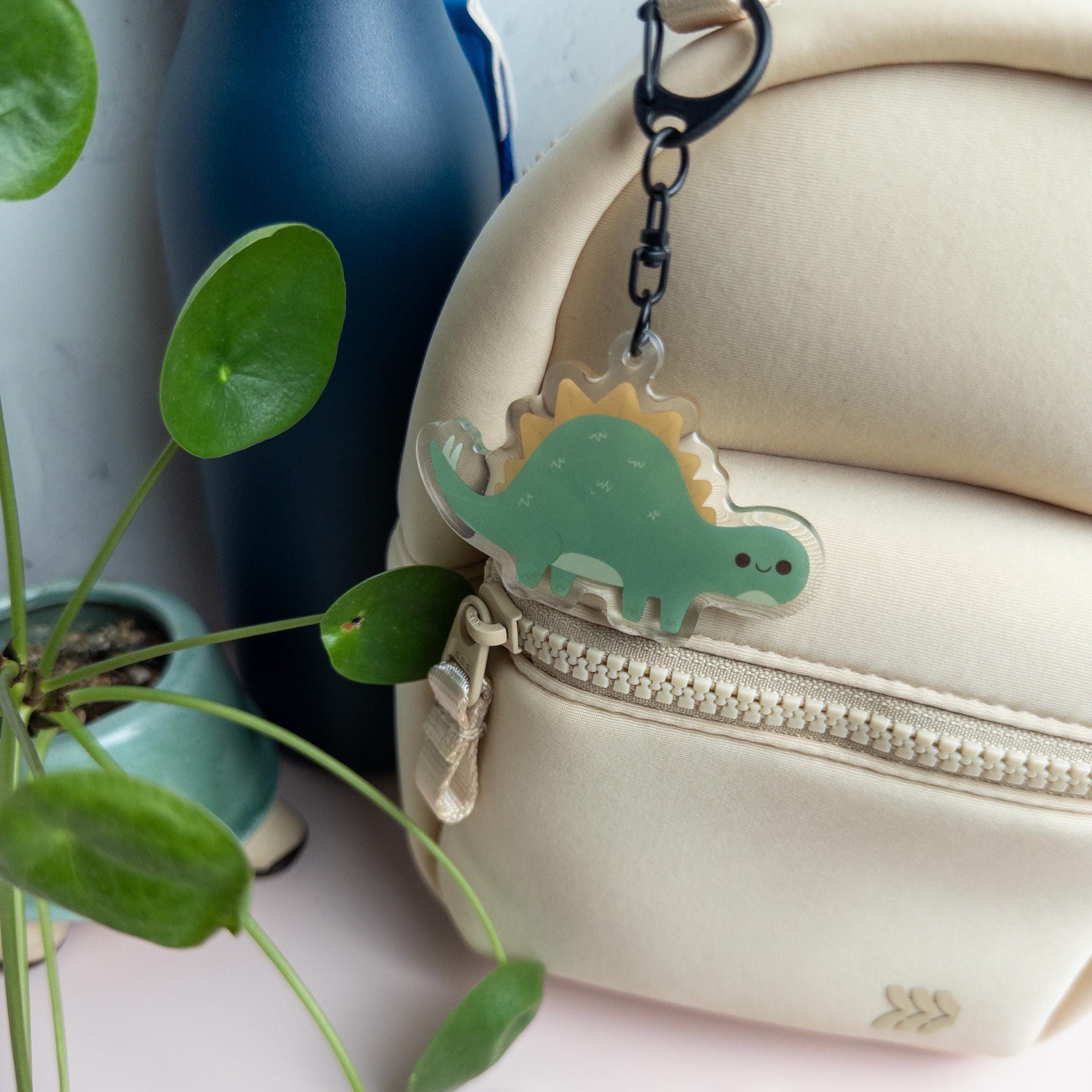 Cute Stegosaurus acrylic keychain with glossy epoxy finish, kawaii dinosaur charm for bags, backpacks, and keys.